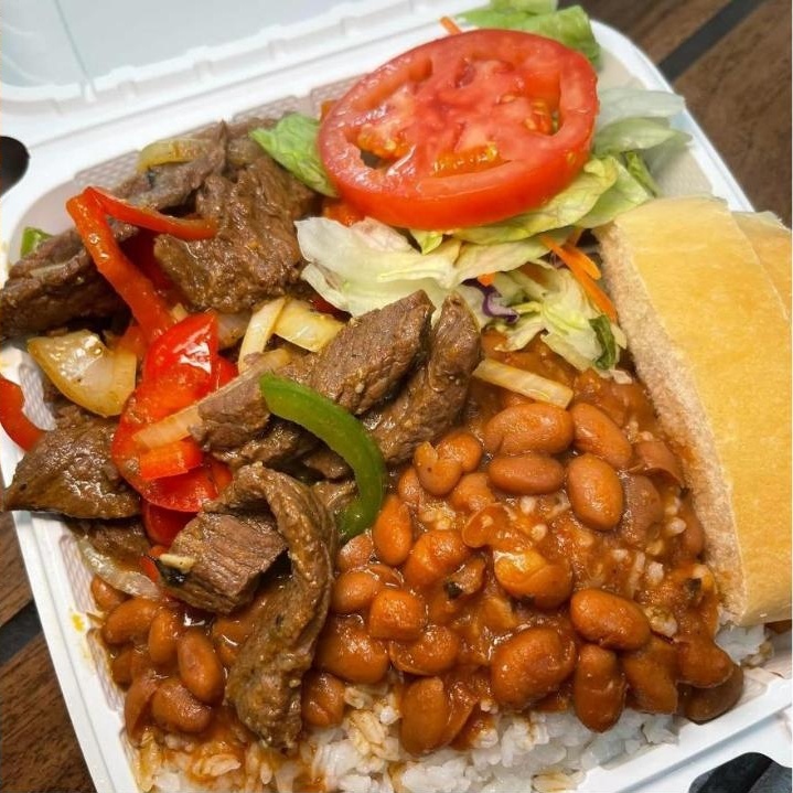 Pepper steak with rice, stewed beans and bread
