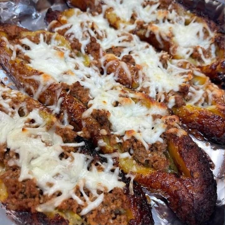 Pastelón — layered sweet plantain and seasoned beef under melted cheese