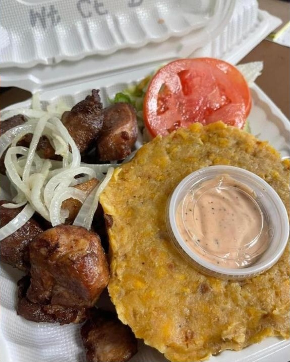 Mofongo — green plantain mashed in the pilón, with fried pork and onions